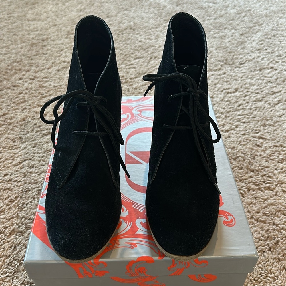 Kelsi Dagger “Fanetta” black suede wedge boots.